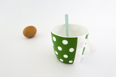 Empty green coffee cup with white dots separated from white background.の写真素材