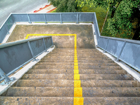 Pedestrian overpass stairs cross the traffic lights.