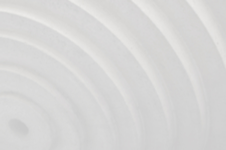 Decorative white cement wall background of abstract waves.