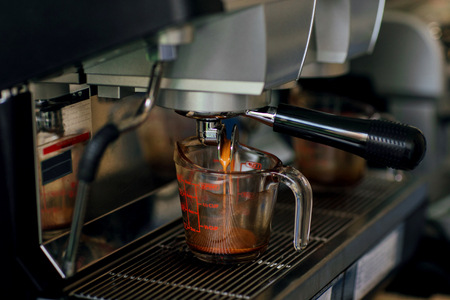 Coffee machine make coffee with in cafe vintage color tone. Focus selectionの写真素材