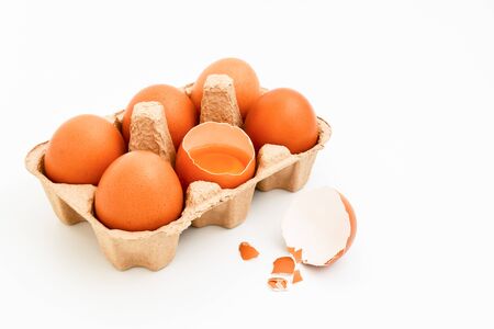 Broken egg isolated on white background, top view. With copy areaの写真素材