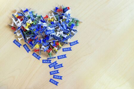 Colorful Thumbtack on wooden background. Set of multicoloured Thumb Pins also called Push Pins which...