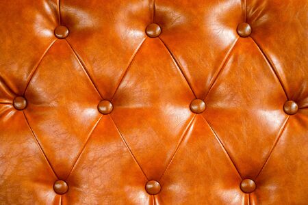 Orange leather sofa background. vintage style and geometry patternの写真素材