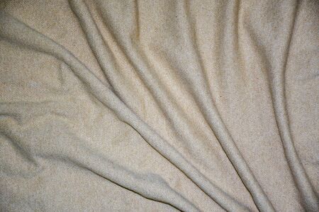 Elegant Beige cotton fabric texture background. fabric crumpled background, Abstract background, empty template. close upの写真素材