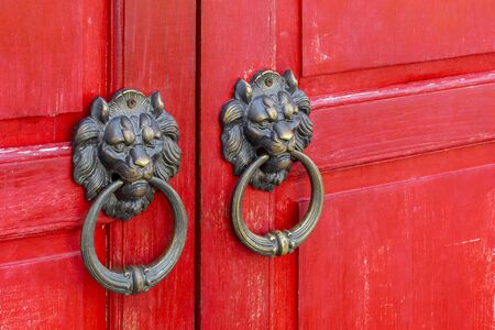 Lion Head Door Knob Closeup With Red Chinese Style Wooden Door