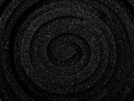 macro photography of the surface of a rolled-up black sponge foam. Top viewの写真素材