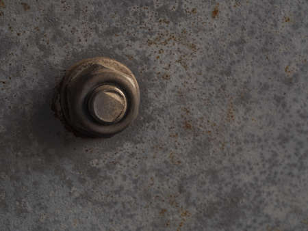 Rusted bolt and nut on a rusted iron surface close-up macro photography.