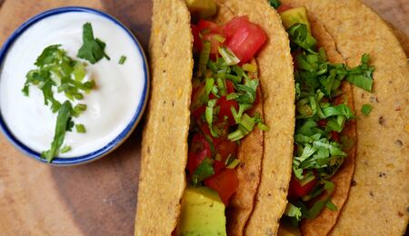 Veggie Tacos for Lunch with sour creamの写真素材