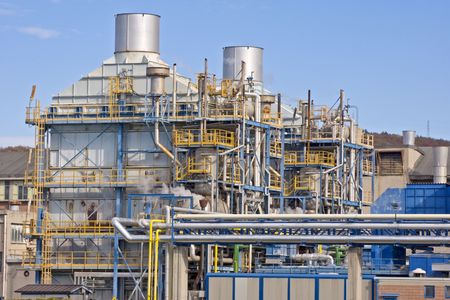 Industrial building with pipes and chimneysの写真素材