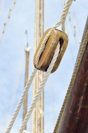 Close-up of block with ropes on a vintage sailboatの写真素材