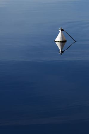 Detail of a white buoy in a calm seaの写真素材