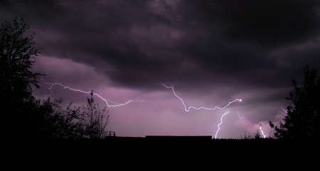 Lightning Storm and Skyline Silhouetteの写真素材