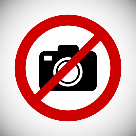 Camera in red ban on a white background.  No photographyのイラスト素材