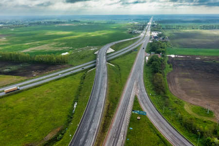 Multilevel transport interchange aerial view, clear sunny summer day, green grass. Summer industrial landscape.の写真素材