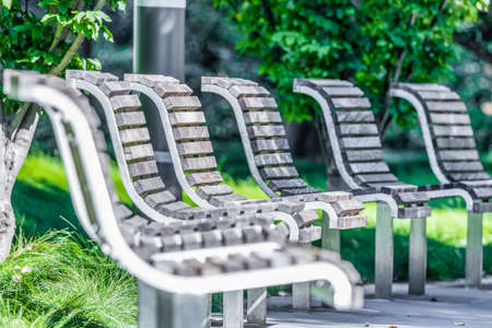 Benches in Salesforce Park in San Francisco, close-up, shallow depth of field, photograph processed, in pastel colorsの写真素材