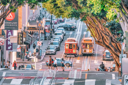 San Francisco, California, USA - October 16, 2021, a descending row of stately houses on a hill and...