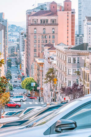 San Francisco, California, USA - October 16, 2021, descending row of stately homes on a hill, a typical neighborhood in San Francisco. Photo processed, in pastel colorsのeditorial素材