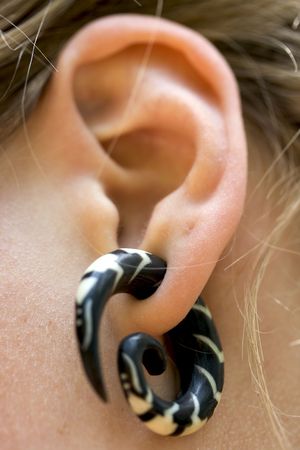 a big earring in a girl earの写真素材