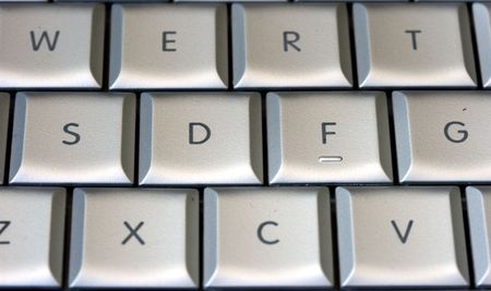 a silver keyboard of a laptop