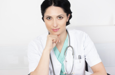 Portrait of a beautiful doctor in her officeの写真素材