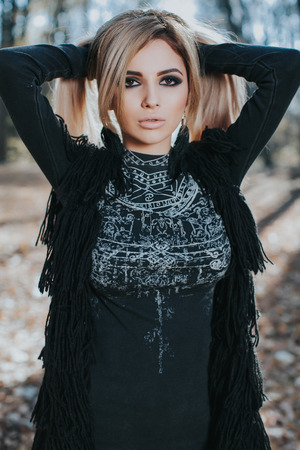 Beautiful woman posing in the forestの写真素材