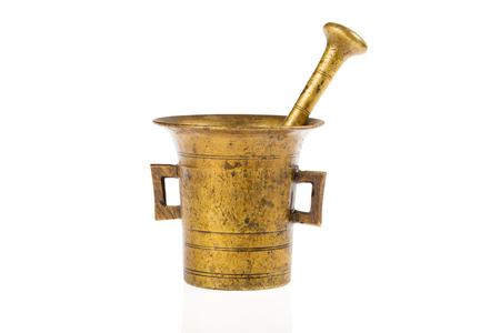 One old bronze mortar photographed in studio on white backgroundの写真素材