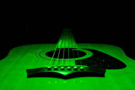 green illuminated acoustic guitarの写真素材