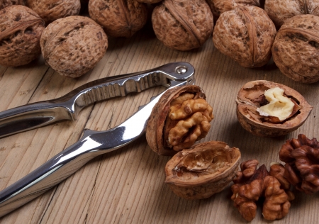 Group of walnuts on old wooden table