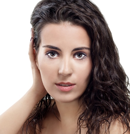Close-up portrait of a beautiful young brunette   White backgroundの写真素材