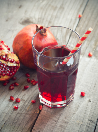 glass of pomegranate juice with fresh fruitsの写真素材