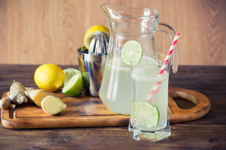 homemade lemonade with ginger on a rustic wooden backgroundの写真素材