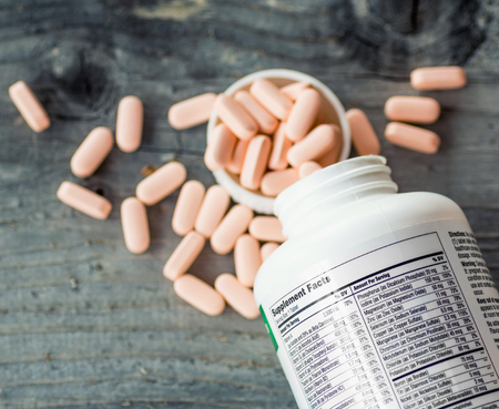 Supplement facts, Closeup of a bottle of vitaminsの写真素材