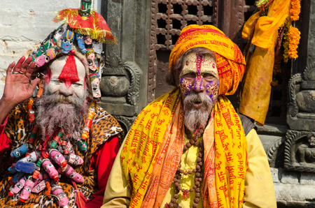 Kathmandu, Nepal - February 19, 2014: unidentified Sadhu Holy men with traditional painted face, blessing in Pashupatinath Temple. February 19, 2014, Kathmandu, Nepal.のeditorial素材
