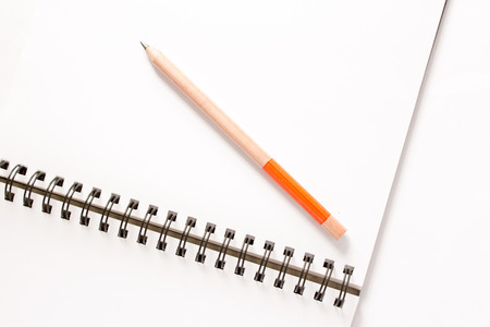 notebook with  pencil on white.の写真素材