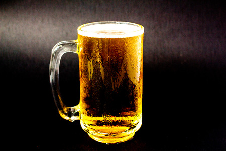 The glass of light beer light came in.の写真素材
