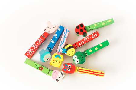 colorful wooden clothespins close up  on white backgroundの写真素材