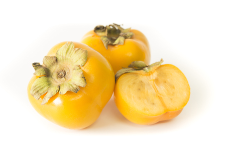 fresh ripe persimmons isolated on white background.の写真素材