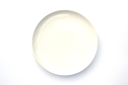 white ceramic round plate isolated on white background.の写真素材