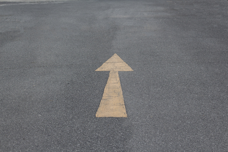 yellow arrow on the road.の写真素材