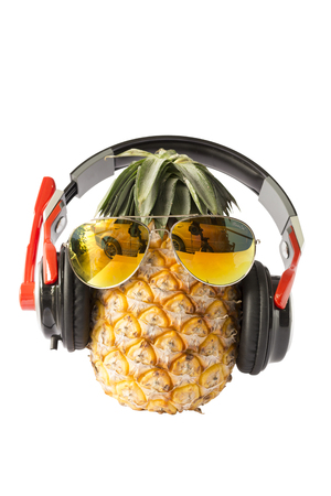 pineapples with sunglasses and earphone  isolated on white background.の写真素材