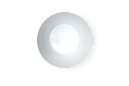 Empty ceramic round plate isolated on white background.の写真素材