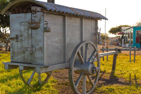 Old horse-driven wagon that today serves as crafts. Ancient object that served as a means of transport and cargo. Decoration object.の写真素材