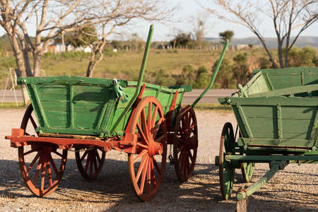 Old horse-driven wagon that today serves as crafts. Ancient object that served as a means of transport and cargo. Decoration object.の写真素材