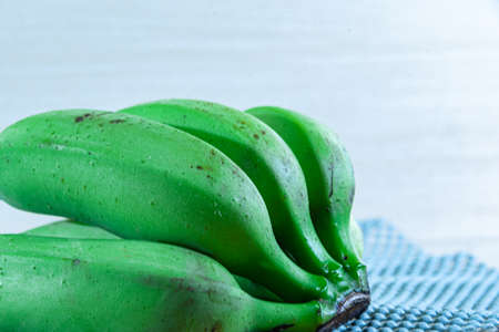 A bunch of bananas. green and not yet ripe bananas. Tropical fruit. Fiber rich food. Detox diet. Natural food. Banana fruit. bunch of green bananas.の写真素材