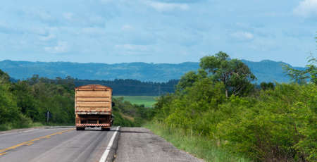 Image of a cargo transport truck running on the Brazilian highway in the south of the country. Transport infrastructure and logistics.の写真素材
