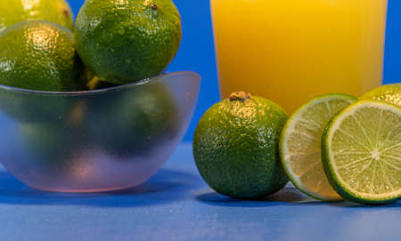 Bottle of lemonade. Lemon fruits. Source of vitamin C thiamine, riboflavin and minerals (phosphorus, silicon, calcium and iron). Refreshing and natural drink. Drink of acid fruits. Caipirinha.の写真素材