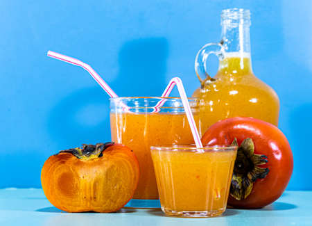 Persimmon fruit juice (Diospyros kaki L.). Edible fruit. Drink rich in fiber. Detox diet. Natural food. Fruit source of protein, carbohydrates, potassium, phosphorus and vitamin C.