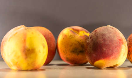 Peach fruit. Fruit that originates in China, where it is considered the tree. Its tree can reach 8 meters in height, presenting serrated leaves and flowers with a purple hueの写真素材