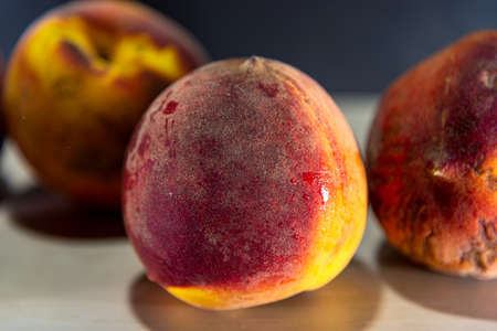 Peach fruit. Fruit that originates in China, where it is considered the tree. Its tree can reach 8 meters in height, presenting serrated leaves and flowers with a purple hueの写真素材