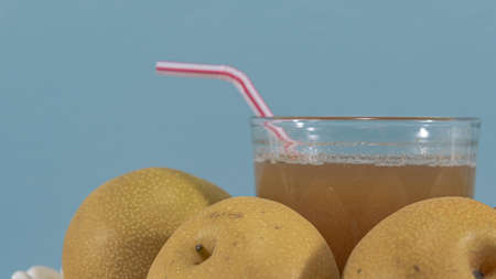 Fresh pear fruits. Blue background. Natural fruits. Refreshing drink and detox. Healthy eating....